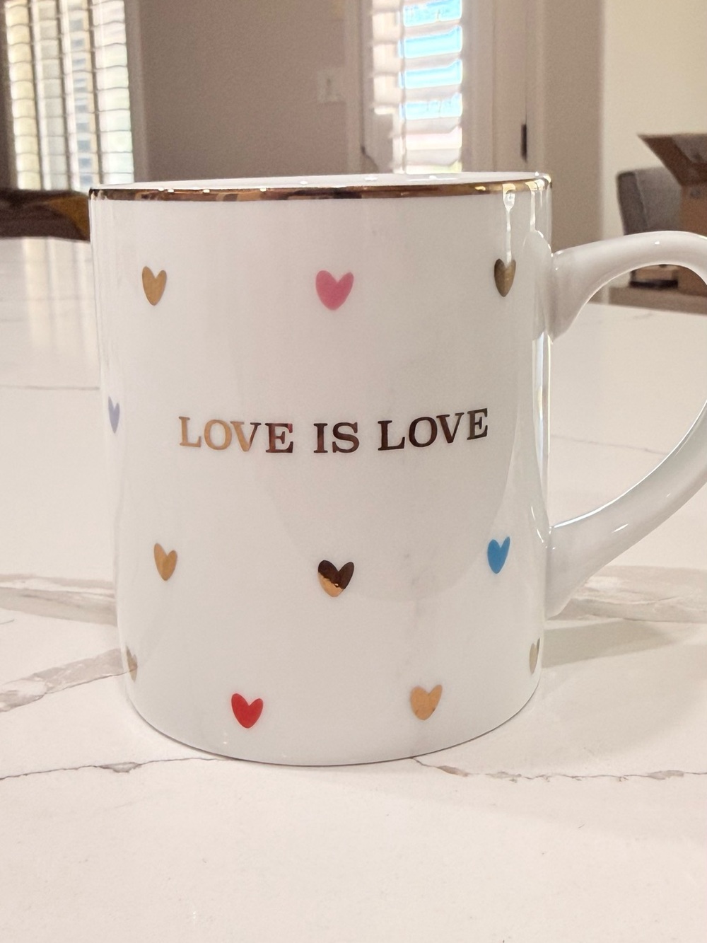 Williams Sonoma "Love is Love" ceramic coffee mug.